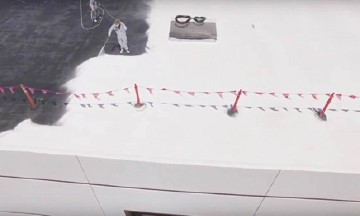 Man applying spray roofing